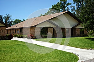 Florida duplex with beautiful lawn