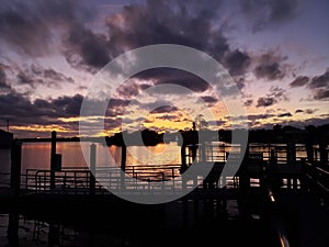 Florida fishing pier sunset clouds water gulf