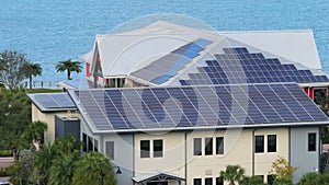 Florida office building with solar roof. Blue photovoltaic panels for producing clean ecological electric energy