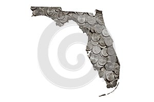 Florida State Map Outline with Piles of United States Nickels, Money Concept photo
