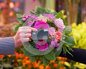 Florist, flowers and hand of woman with credit card for payment, tap and floral purchase. Closeup of flower, bouquet and