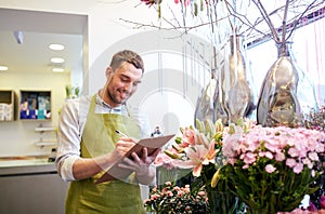 Florist man with clipboard at flower shop