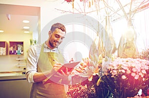 Florist man with clipboard at flower shop