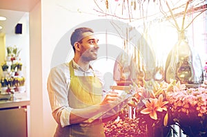 Florist man with clipboard at flower shop