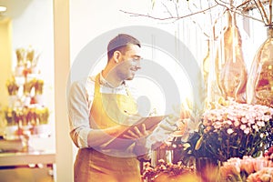 Florist man with clipboard at flower shop