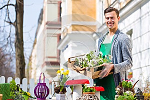 Florist with plant supply at shop