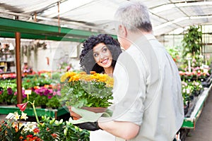 Florist selling flowers to a customer