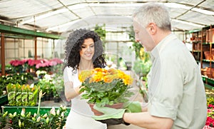 Florist selling flowers to a customer