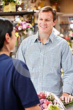 Florist serving customer