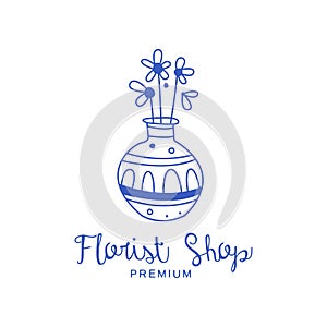 Florist shop premium logo, badge for floral boutique, florists hand drawn vector Illustration in blue color on a white