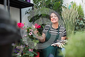 Florist with tools in the gardening store