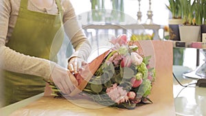 Florist woman with flowers and man at flower shop