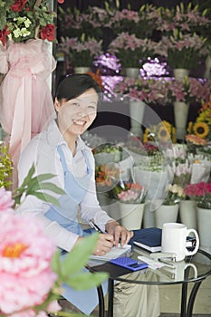 Florist Working In Flower Shop