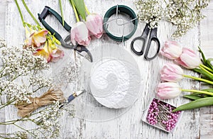 Florist workplace: woman making floral arrangements