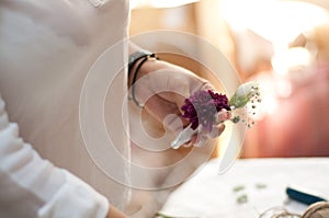 Florists Making a Beautiful Wedding Flower Bouquet of Purple Roses