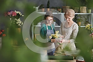 Florists making floral arrangement photo