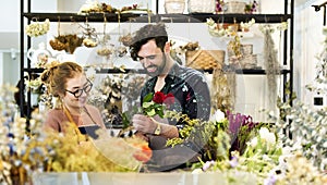 Florists making flower bouquet together photo