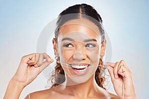 Flossing teeth, woman and happy in studio for hygiene, clean or routine on white background. Brazil female person, gum