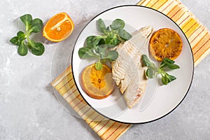 Flounder baked with tangerines