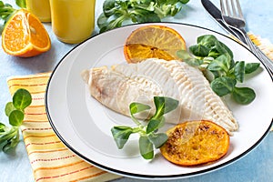 Flounder baked with tangerines