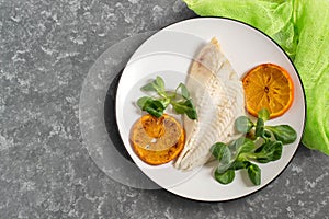 Flounder baked with tangerines