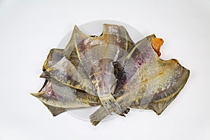 Flounder Lat. Pleuronectes platessa dried without a head folded in a fan isolated on a white background. Food photo