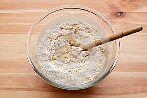 Flour being stirred into batter for banana bread