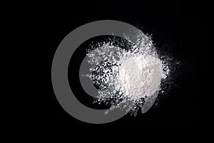 Flour on the black background