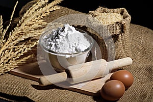 Flour in bowl with eggs and rice