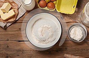 Flour in bowl with Ingredients for cooking bakery products