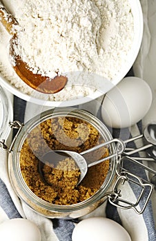 Flour, brown sugar and eggs for baking