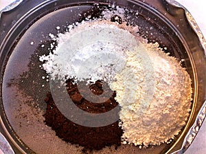 Flour Cocoa and Icing Sugar in a Sift