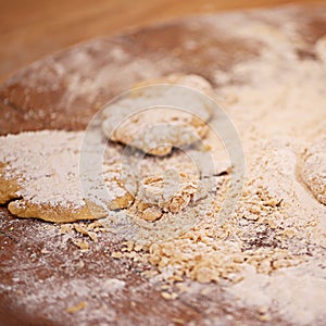 Flour, dough and pastry for baking in kitchen on table, counter and wooden board for dish. Food, cooking and closeup of