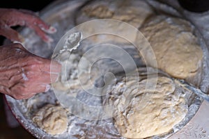 Flour dough sprinkled on a tray