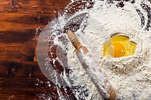 Flour, egg and rolling pin with copy space