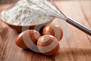 Flour and eggs as ingredients for making pasta dough