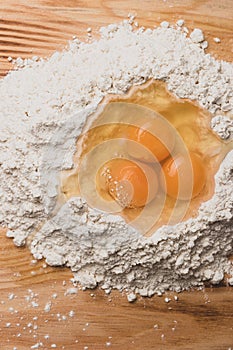 Flour and eggs as ingredients for making pasta dough