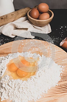 Flour and eggs as ingredients for making pasta dough