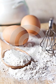 Flour, eggs and kitchen utensil