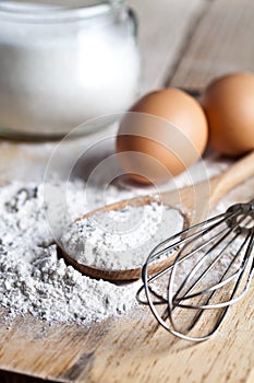 Flour, eggs and kitchen utensil