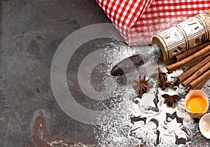 Flour, eggs, rolling pin and cookie cutters. Christmas food