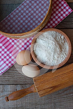 Flour with egs and rolling pin