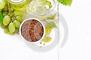 Flour grape seed in bowl on board top