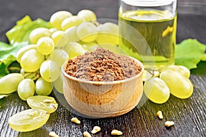 Flour grape seed in bowl on table