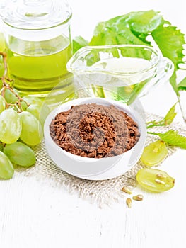 Flour grape seed in bowl on white board