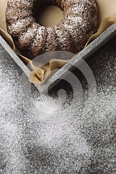 Flour and kitchen utensils on a dark table. Christmas baking. Food background. Winter holiday background. Template