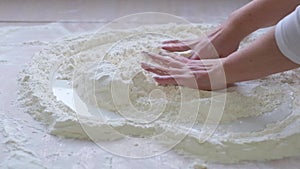 flour like sand on the sea slow motion background for the text female hands stir the flour in form of heart they