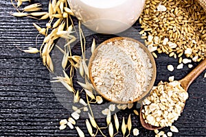 Flour oat in bowl on wooden board top