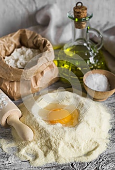 Flour, olive oil, eggs - the ingredients to prepare the dough for pasta