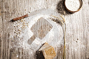 Flour powder and bakery on wooden table